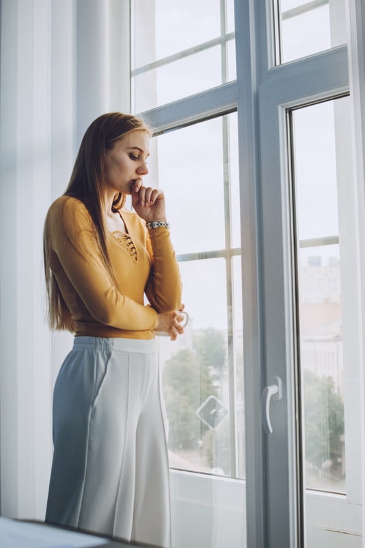 Sad Woman by the Window